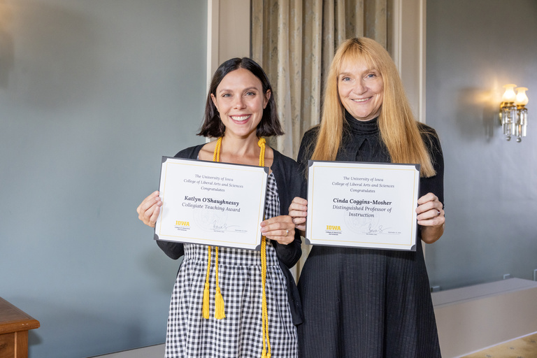 Katlyn O'Shaughnessy and Cinda Coggins-Mosher holding their certificates from the 2025 CLAS Faculty Awards event