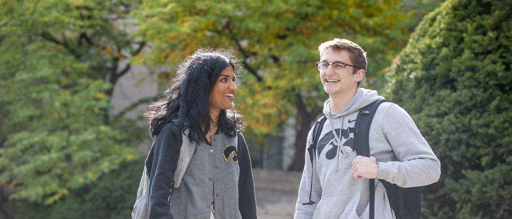 Students walking on the Pentacrest at the University of Iowa